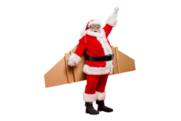 Full length photo of funny shocked elderly superhero pensioner in santa claus hat costume ready to travel craft flight fly up travel wear xmas cap pants isolated over red color background