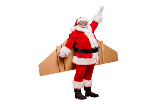 Full length photo of funny shocked elderly superhero pensioner in santa claus hat costume ready to travel craft flight fly up travel wear xmas cap pants isolated over red color background