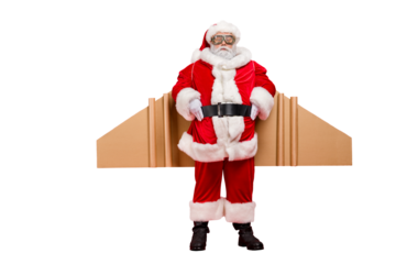 Full size photo of funky super pensioner in santa claus costume ready to hurry on speed cardboard imagine travel craft wings wear cap goggles hat isolated over red  background