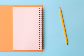 Pastel Blue and Pink Notebook with Pencil on Orange Background