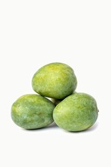 Closeup of Harvested Raw Mango Heap Isolated on White Background with Copy Space