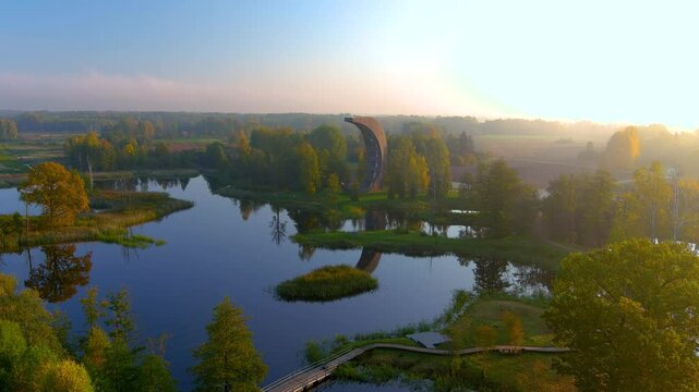Amazing aerial view of Kirkilai karst lakes and lookout tower in the bright sunny autumn morning, Birzai eldership, Panevezys county, Lithuania