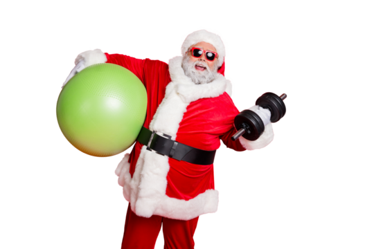 Portrait of excited christmas father in eyewear eyeglasses practice fitness with dumbbells fitball isolated over red background