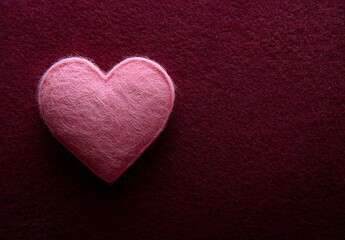 Obraz premium Pink Felt Heart on Burgundy Background