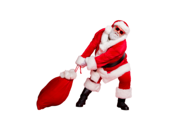 Full body photo of unhappy crazy having hipster style funny Santa in fur coat trousers boots cuffs dragging large bag full of different giftboxes for children isolated bright background