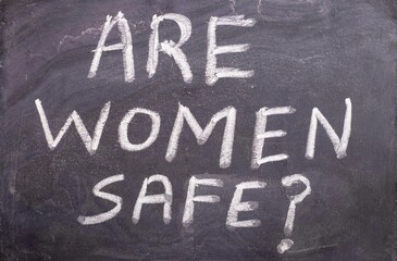 Are Women Safe with Question Mark Written on Blackboard with White Chalk