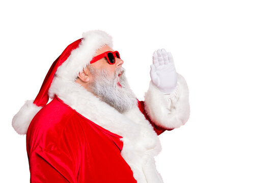 Profile side photo of funny santa claus screaming promotion newyear resolution wearing eyeglasses eyewear bright hat isolated over red background
