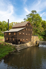 Pine Creek Grist Mill, built in 1848, on a sunny summer morning at Wildcat Den State Park.  Muscatine, Iowa, USA.