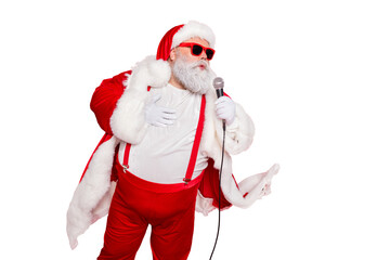 Portrait of charming fat overweaight santa claus with big belly hold microphone sing wear style stylish trendy eyewear eyeglasses hat cap isolated over red background