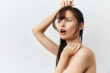 A woman tries on false bangs.