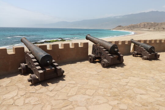 military cannons of mirbat fort on the sea in oman 