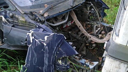 Broken Damaged Minivan Car Wreck Abandoned on Scrapyard For Recycling