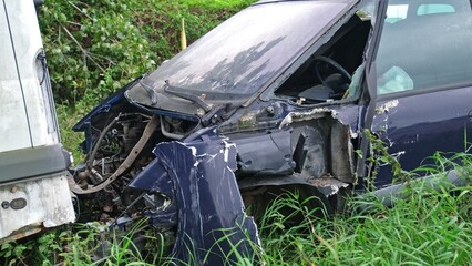 Broken Damaged Minivan Car Wreck Abandoned on Scrapyard For Recycling