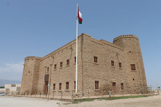 mirbat fort on the sea in sultanate of oman with blue sky , old building