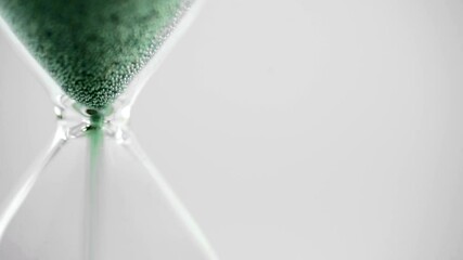 Close-Up Sand Timer with Green Sand Representing Climate Action and Sustainability, Climate Clock