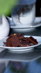 Chocolate with nuts on the plate . High quality photo