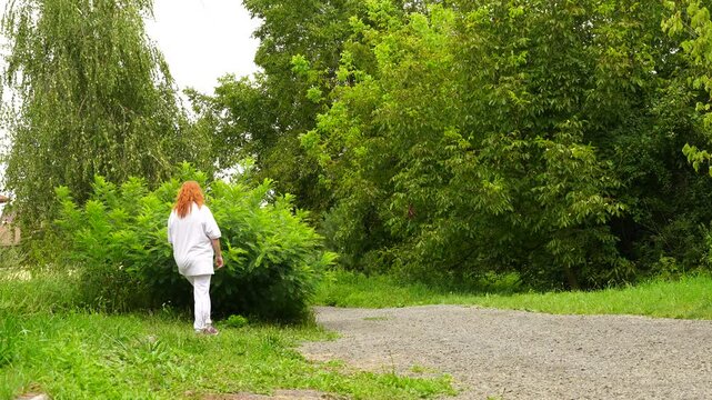 Senior woman walks relaxing outdoor on nature