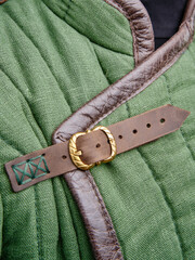 Historical fashion. Medieval knight cloth. Padded jacket gambeson.