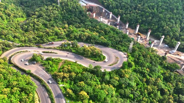 ariel view of The modern roadways connect the mountains, allowing vehicles to travel smoothly through the scenic terrain.