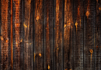 Dark brown and orange wooden background.