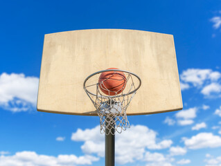 Amateur basketball hoop against the sky.