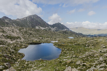 Estany del Cap dels Pessons, lake de Pessons in the Pyrenees mountains of Andorra, summertime