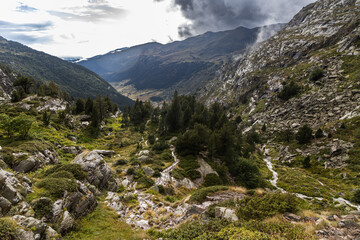 Vall d'incles, valley in the mountains after the rain, stormy clouds