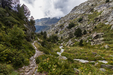 Vall d'incles, valley in the mountains after the rain, stormy clouds