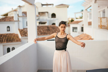 Graceful Dance Posing Elegantly on a Beautiful Terrace with a Stunning Scenic Background