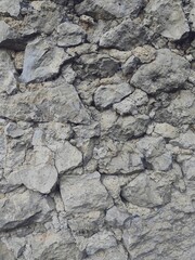 Natural wall rocks stone in a forest with liken. Background or digital use.