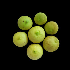 Fresh yellow jujube fruit isolated on black background