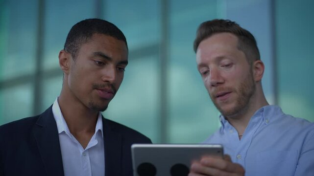 Business Professionals Collaborating Over Technology to Achieve Their Common Objectives