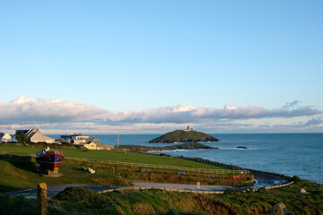 view of Ballycotton lighthouse, nice weather, beautiful sky and clouds