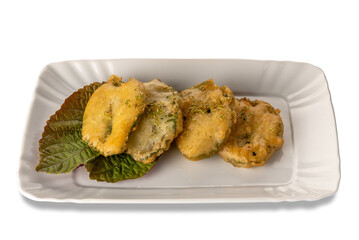 Batter-fried sage leaves in white plate isolated
