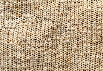 Fototapeta premium Beige Knitted Fabric Texture with Brown and Orange Speckles