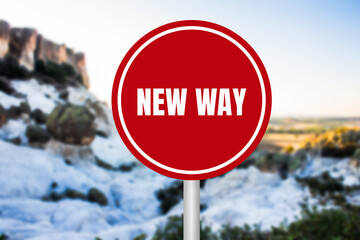 New way message written on red round sign on nature background. Conceptual new way symbol. Copy...