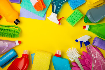 Cleaning service concept.Home cleaning product on a pink background. Bucket with household chemicals. cleaning supplies for home or office space.Early spring regular cleaning. Copy space