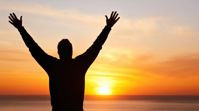 person with raised arms enjoys nature and lives life to the fullest during a beautiful sunset by the sea Jugendwort des Jahres