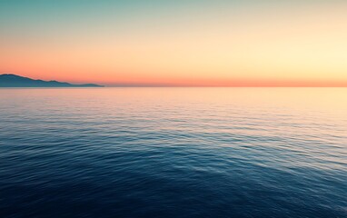 Obraz premium Serene Morning Sunrise Over Calm Sea with Warm Colors and Cool Waters