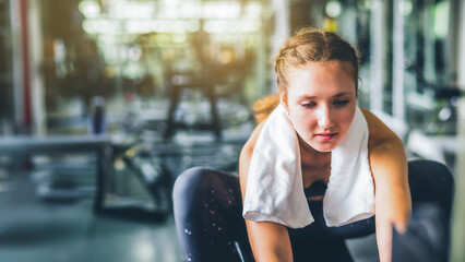 Cinematic tone of young attractive fitness woman exercise at gym. Individual sport to fit muscles of body for healthy life concept.