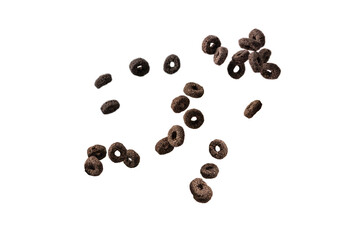 Chocolate rings cereal spill out into a bowl. Breakfast.