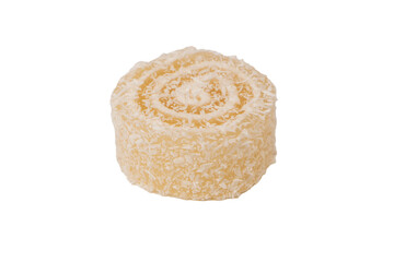 Coconut candy roll isolated on a white background.