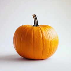 Obraz premium Orange pumpkin on a white background, a simple studio photograph, product photography, soft lighting