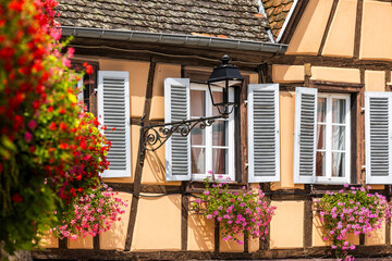 Old half-timbered house in the historic medieval old town of Eguisheim in Alsace and on Alsace Wine...