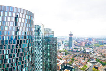 Commercial area, highrise tower office building in Deansgate Manchester, overcast day, aerial view