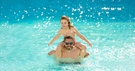 Father and son in pool. Travel in summer. Sea beach vacation. Son child having fun with his father. Pool time. Fathers day. Parenthood. Summer vacation of happy family. Family-friendly activities