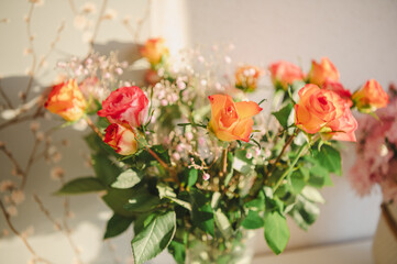 A bouquet of pink and orange roses in close-up