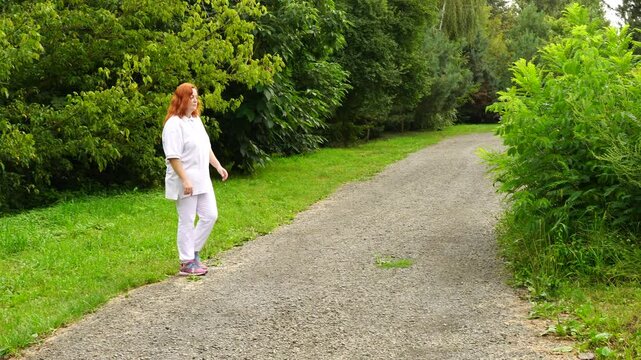 Senior woman walks relaxing outdoor on nature