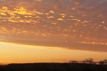 sunset with clouds in the background