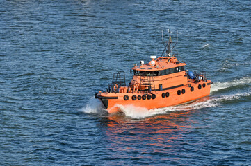 Orange rescue or coast guard patrol boat